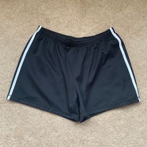 Champion black athletic shorts with white stripe at sides